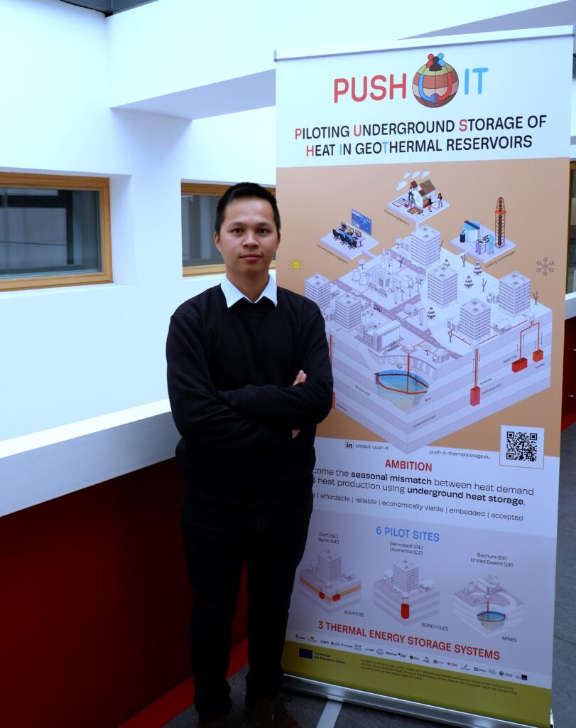 Picture of Hung Pham next to a PUSH-IT banner.