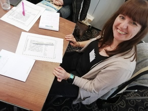 Delegates working on a UTES wordsearch